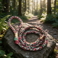 Christmas Edition handmade braided paracord dog leash in festive red green and gold on forest stone - Rove Cord
