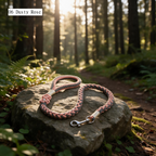 Meadow Bloom braided cotton dog leash in 06 Dusty Rose laid on natural stone - Rove Cord
